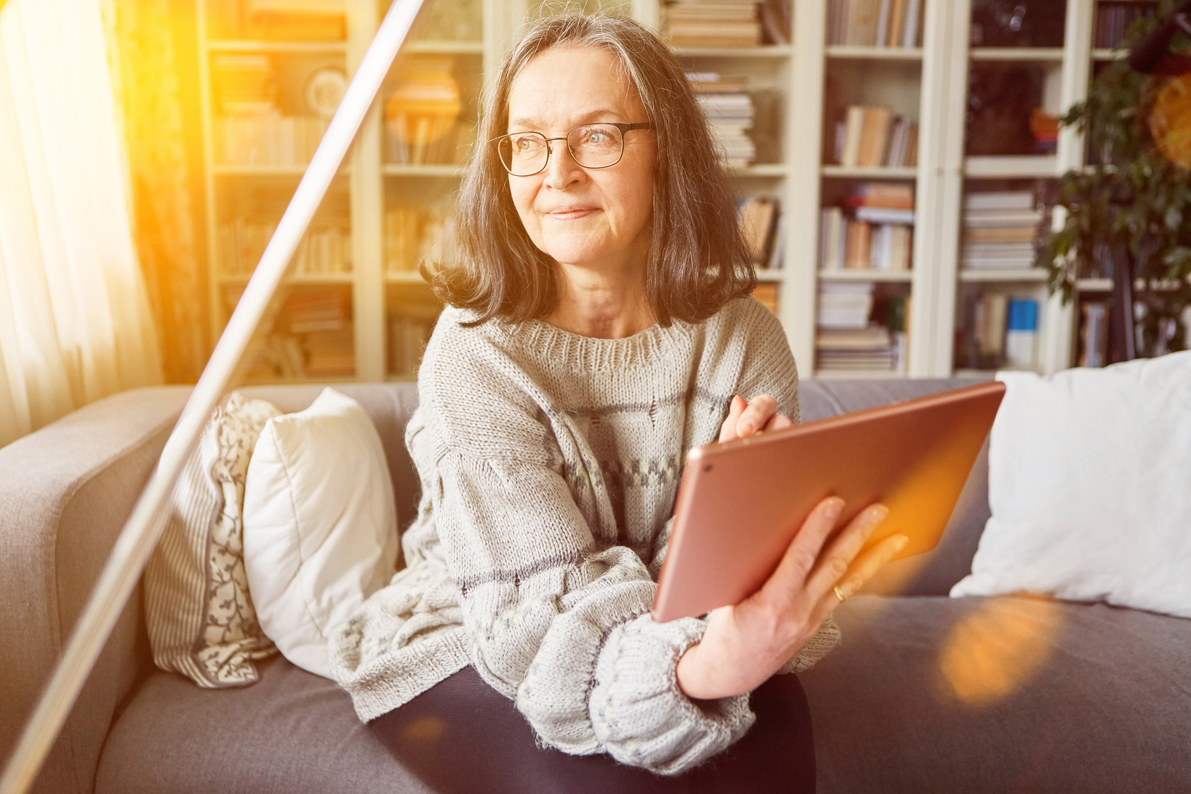 Senior Woman Reading Ebook on Tablet Computer